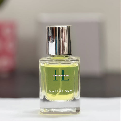 Perfume bottle labeled 'Marine Sky' by IVY & CO on a blurred background